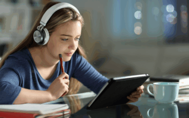 Student reading on tablet